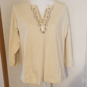 T8 - Crean colored v neck with beaded neckline